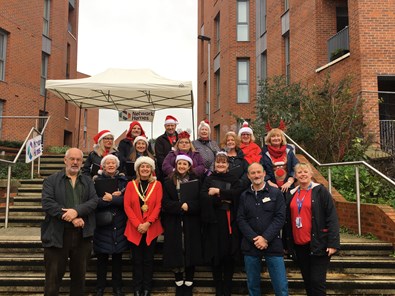 Group shot of Mayor, the Choir and local residents