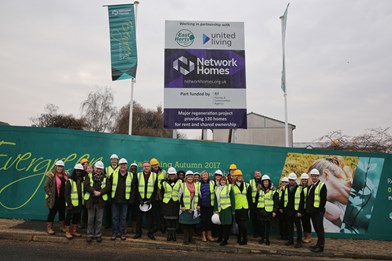 Network Homes joined by East Herts Council, United Living and guest in front of the hoardings at Ridgeway