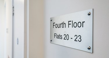 communal signage showing fourth floor flats 20-23
