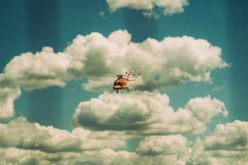 Helicopter flying through clouds